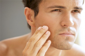 Man touching face